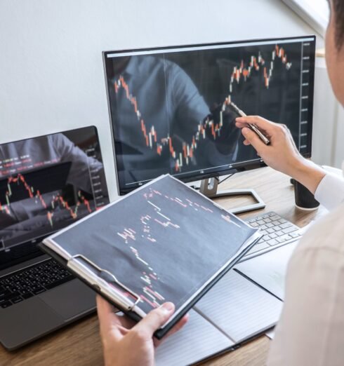 Stock exchange market concept, Business investor trading or stoc Stock exchange market concept, Business investor trading or stock brokers having a planning and analyzing with display screen and pointing on the data presented and deal on a stock exchange.