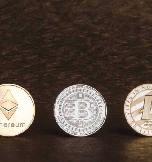 Cryptocurrency litecoin,Silver Bitcoin,Ethereum on golden rough Cryptocurrency litecoin,Silver Bitcoin,Ethereum on golden rough background,Digital cryto currencies.Virtual money