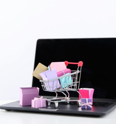 Shopping cart with packages, thumbnail on laptop. Shopping cart with packages, thumbnail on laptop.