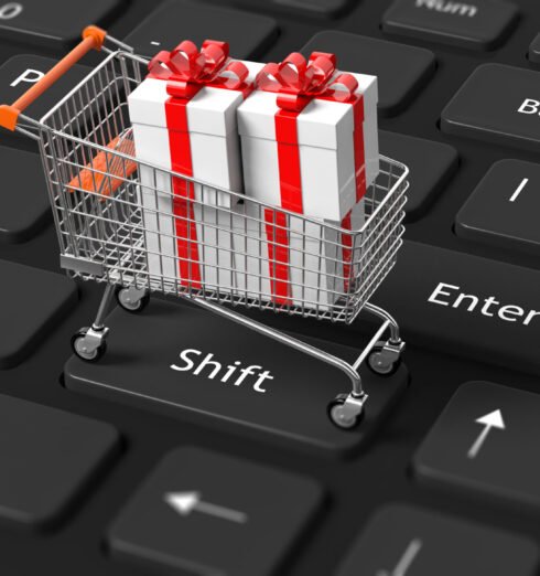 Shopping Cart with present on keyboard 3D rendering of shopping trolley with many presents on black computer keyboard