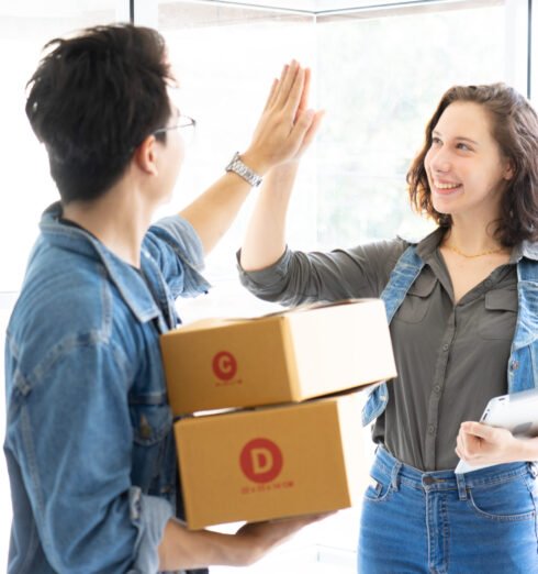 Worker In Warehouse Checking Boxes Using Digital Tablet.Start up Worker In Warehouse Checking Boxes Using Digital Tablet.Start up small business entrepreneur SME or freelance man and woman working at home concept, Young Asian small business owner,online marketing.